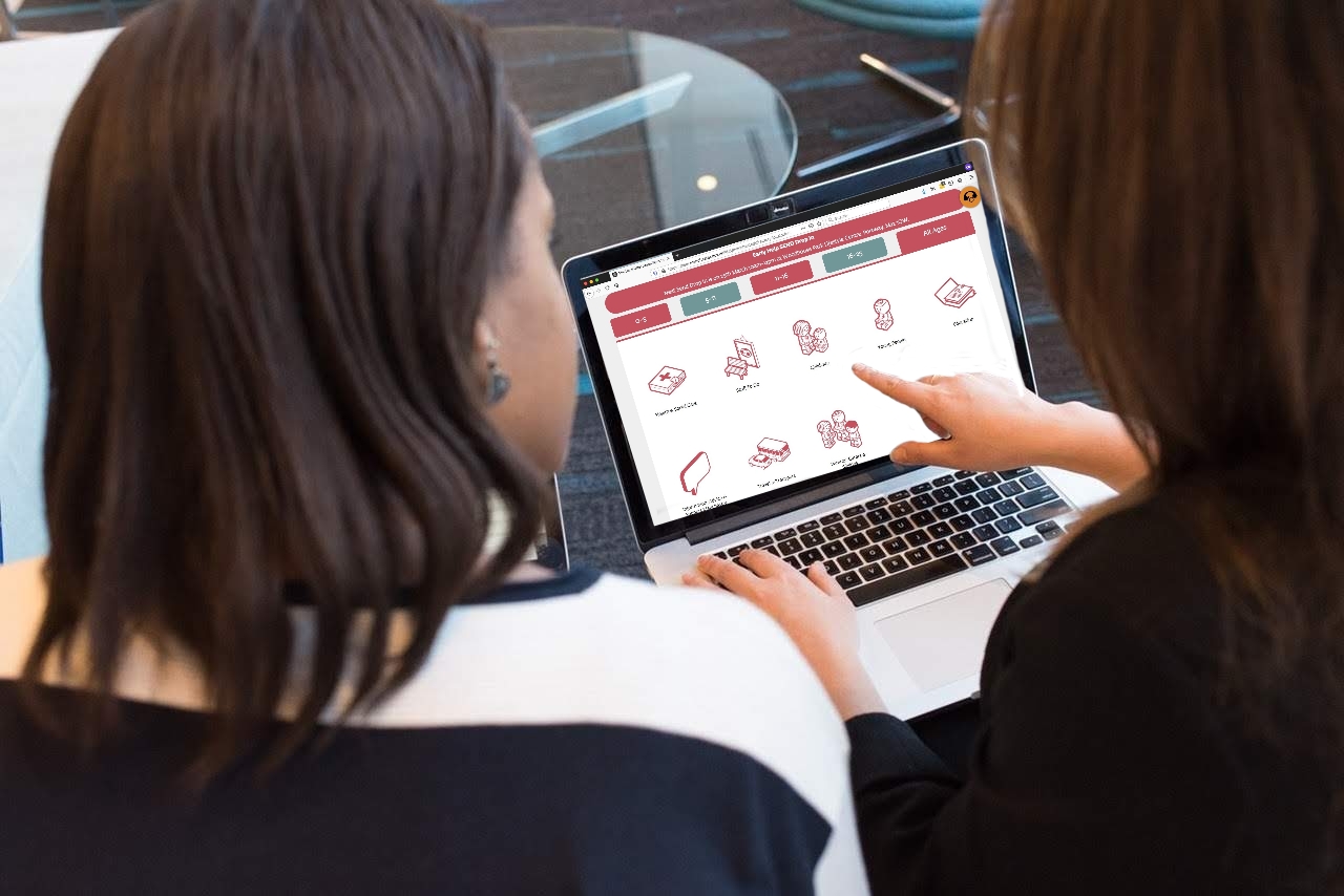 two women looking at the Local Offer website on a laptop | photo credit: pexels.com (edited)