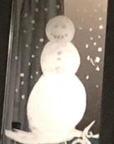 A snowman painted on a mirror