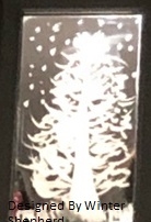 A tree under falling snow, painted on a mirror