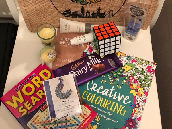 contents of the Parent/Carer Well-being Packs from Manchester Parent Carer Forum & 4CT: MPCF bag, pamper items, activity booklets, chocolates, etc