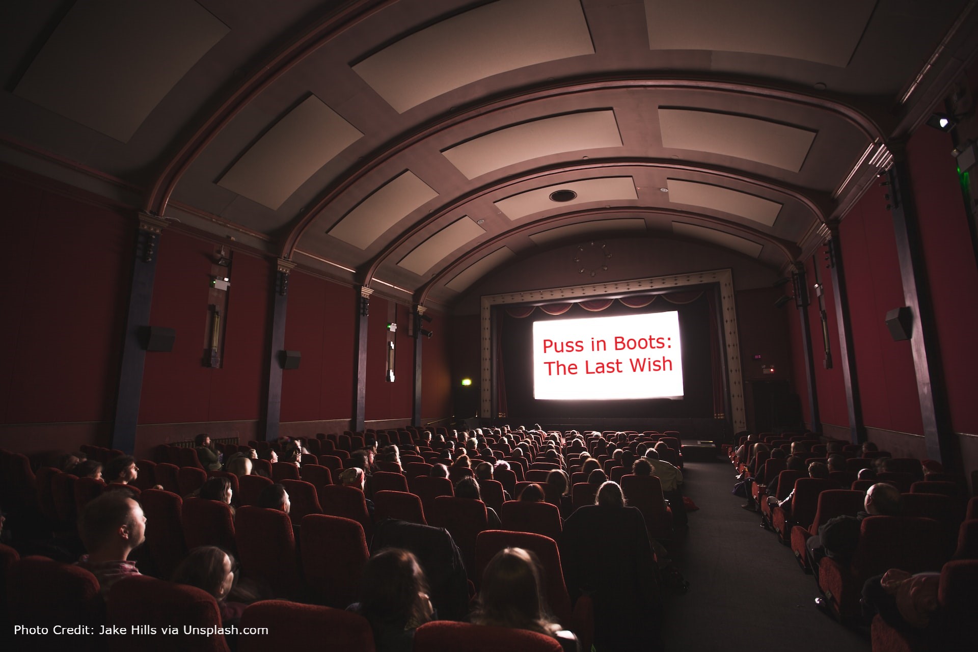 The photo shows a cinema with the words "Puss in Boots: The Last Wish" shown on the screen.
