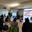 The image shows parents listening to educational psychologists at the "Exploring Types of Schools and Support for Children with SEND" workshop that was held in October 2023.