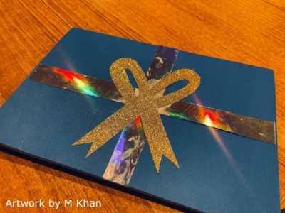 This shows the gift-looking cover of a pop-up card, in blue and gold colours. The text at the bottom-left reads 