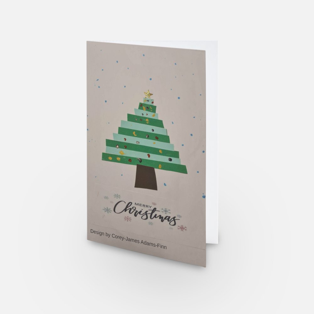 The image shows a mock-up of the festive card with Corey-James' design (showing a Christmas tree).
