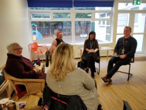 The photo shows a Neurodiversity in Education coffee morning held at Crossacres Family Hub in November 2024 for parents of neurodivergent children and young people who are supported by Southern Cross.