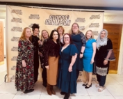 The photo shows the MPCF team posing with the backdrop of the Global Champion Awards of 2025.