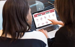 two women looking at the Local Offer website on a laptop | photo credit: pexels.com (edited)