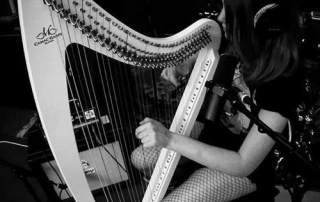 Princess Purple Lemonade is playing the harp. | Photo credit: https://soundcloud.com/disguised_on_mars
