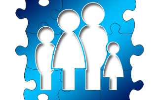 a blue puzzle piece showing an outline of a family - mum, dad, daughter, son | source: pixabay.com