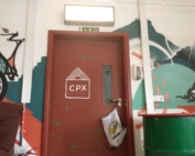 The photo shows the entrance to GRUB/Cultplex's cinema. An MPCF bag is hanging on the door handle.