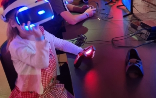 A girl enjoying a virtual reality game at SIM's Power UP exhibition