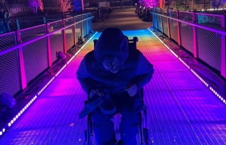 A young person enjoying the lights at Twilight Trail in November 2023.