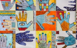 The photo shows a collage of differently coloured illustrations of hands with varying design intricacies.