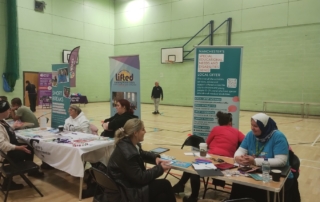 The photo shows various support organisations' / services' tables at the Local Offer Drop-in @ Moss SIde Powerhouse back in 10 September 2025.