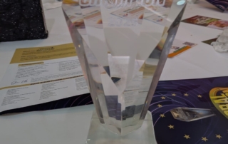 The photo shows our trophy for the Disability Impact category at the Global Champion Awards of 2025.